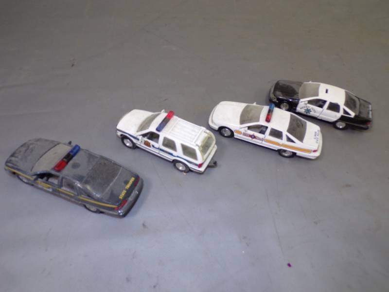 lot 62 image: 4 Police Collectable Cars
