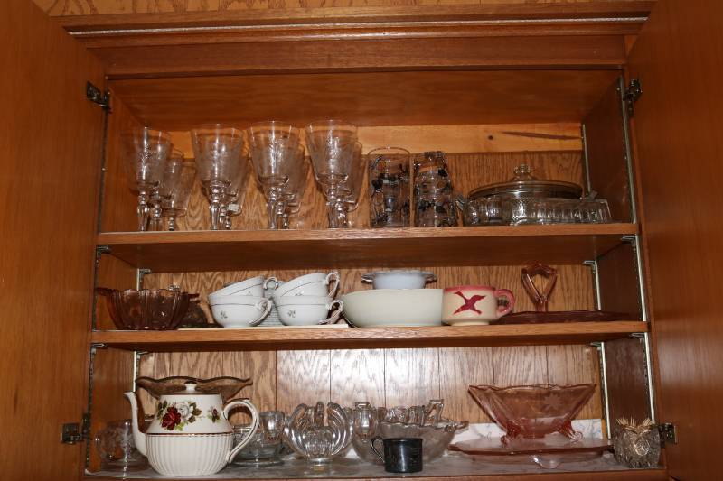 Cupboard full of tea cups, candle h...