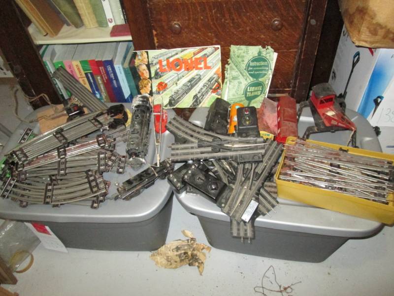 Lot of Lionel train tracks, cars an...
