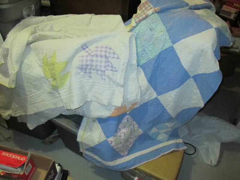 2 vintage hand stitched quilts...