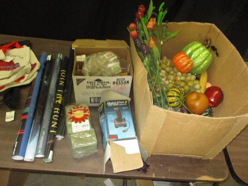 matches, joy stick controller, artifical fruit plastic, posters, bag look at photos