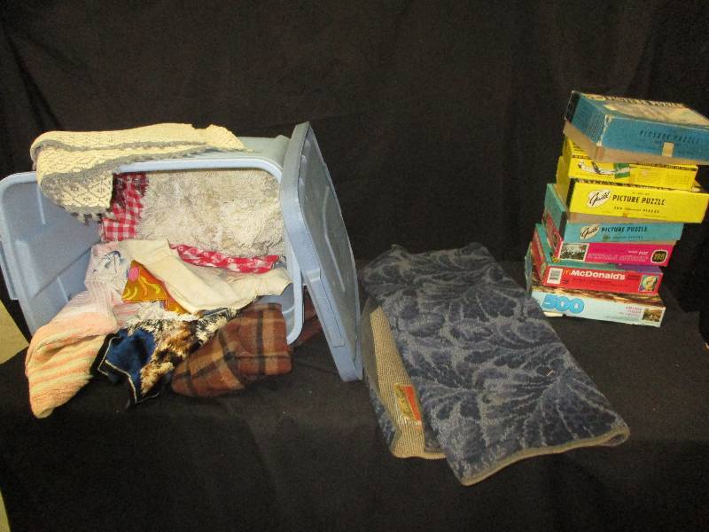 tub of rugs , tub, puzzles in box