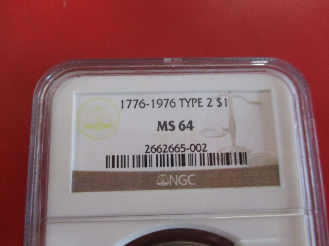 lot 3-3 image: NGC Certified 1776-1976 Bicentennial Eisenhower Dollar Type 2  Mint Staste 64 with Smokey toning.