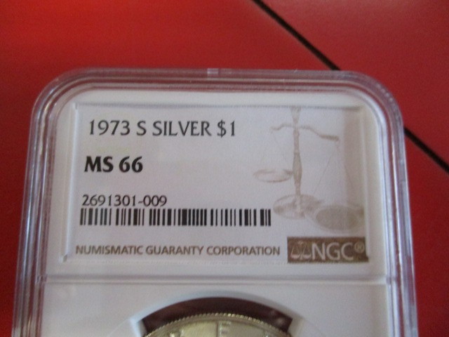 lot 3-5 image: NGC Certified 1973-S (San Francisco Mint) Mint State 66 Silver Eisenhower Dollar. Higher Grade Eisenhower Dollar with certification code for tracking.