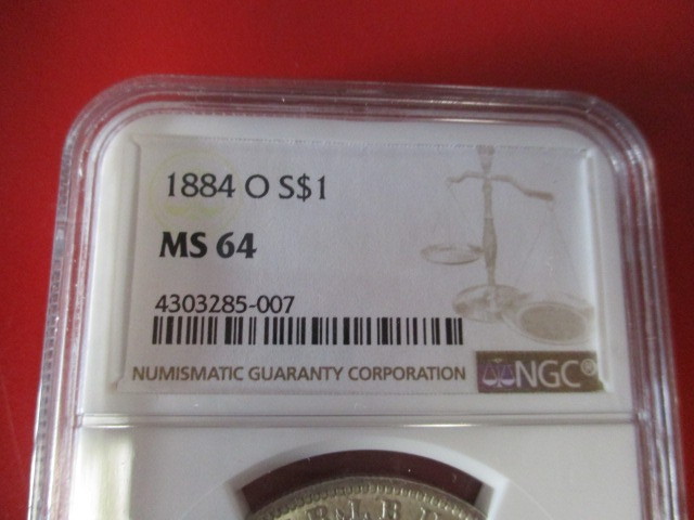 lot 3-8 image: NGC Certified 1884-O (New Orleans Mint) Morgan Silver Dollar in Mint Stat 64 Condition.