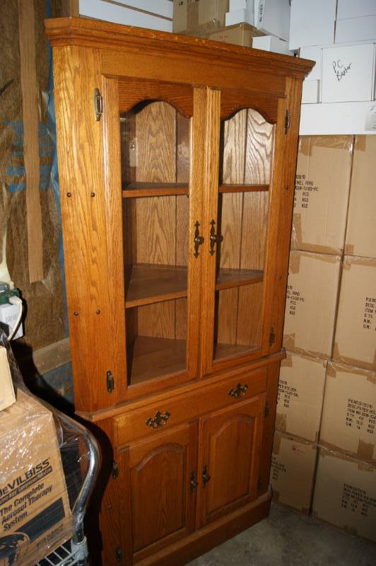 lot 21 image: Wooden Corner Hutch with Glass Door