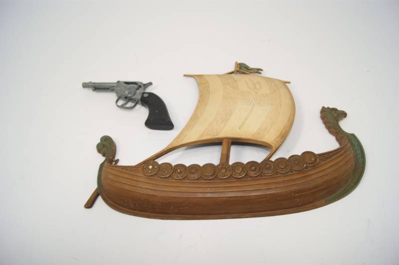 lot 84 image: Viking Ship and Toy Cap Gun