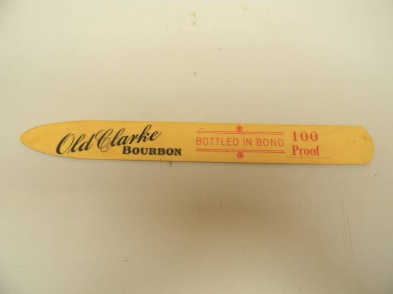 lot 54 image: VINTAGE OLD CLARKE BOURBON & RYE FOAM SCRAPER - VERY RARE NICE - SEE PICTURES