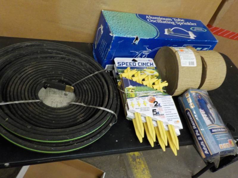 lot 181 image: Stearns Rainsuit, sprinkler, Stakes...