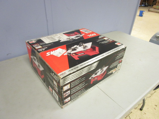 lot 218 image: NEW SKIL 7 WET TILE SAW