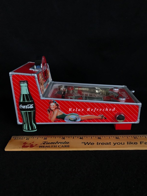 lot 86 image: Vintage Coca-Cola Pinball Machine Battery Operated Musical Coin Bank