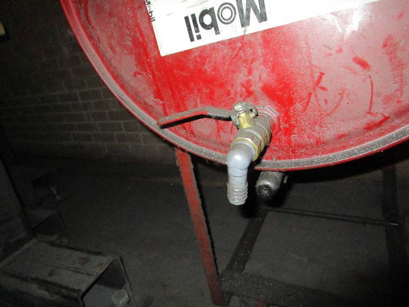 lot 38 image: 55 gal Barrel wStand on wheels