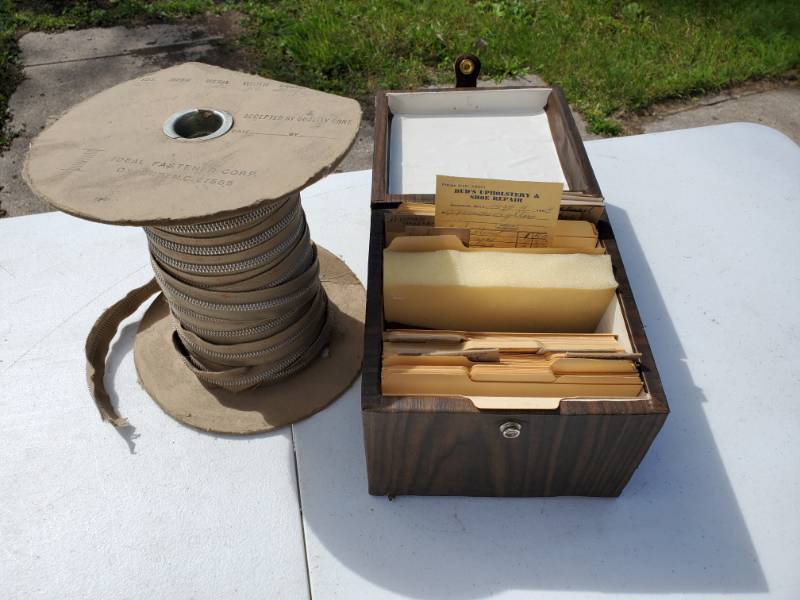 lot 48 image: Roll of zipper replacement & receipt box from a old leather store