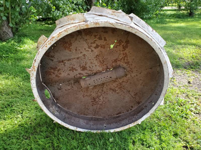 lot 68 image: Old Tractor Wheel converted into a forge table