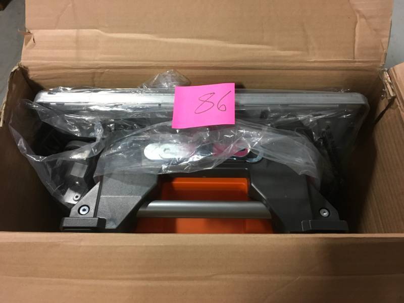 lot 86 image: RIDGID 6.5 Amp Corded 7 in. Table Top Wet Tile Saw in very good condition