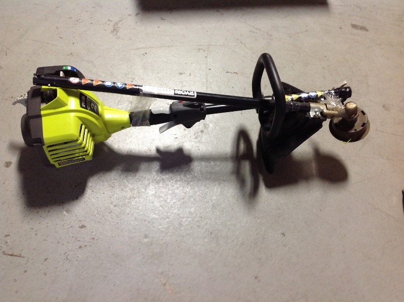 lot 105 image: RYOBI 25cc 2-Cycle Attachment Capable Full Crank Straight Gas Shaft String Trimmer used in good condition