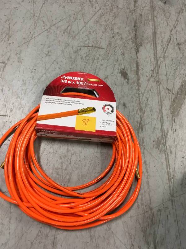 lot 87 image: Husky 38 in. x 100 ft. PVC Air Hose in very good condition
