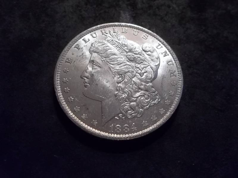 lot 5 image: 1884 O Morgan Silver Dollar