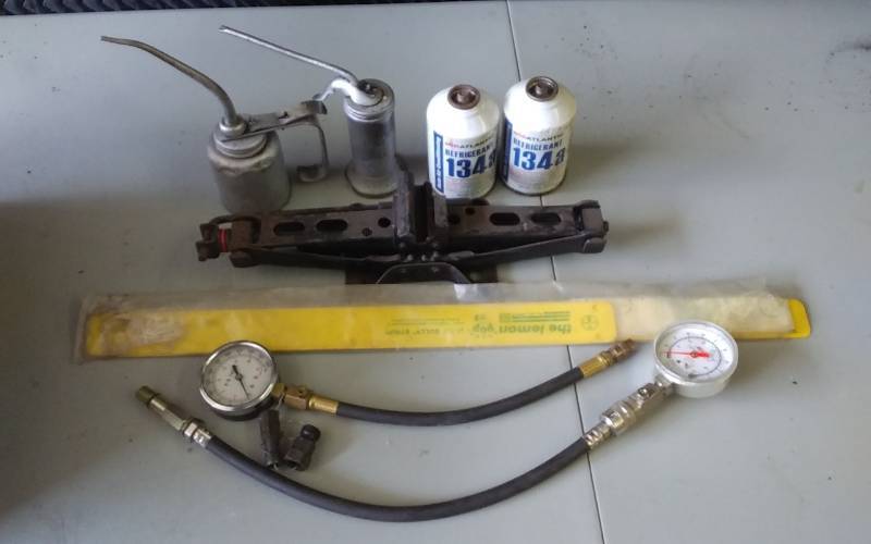 lot 42 image: 2-Compression Testers, Refrigerant, Oil Cans, Jack, Lock-Out Strips