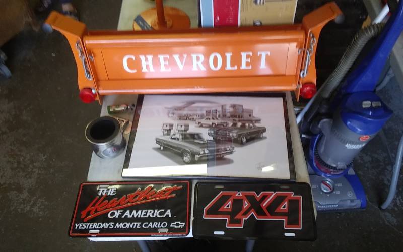 lot 90 image: Chevrolet Tailgate Wall Shelf, License Plates, Corvette Cup Holder, Misc