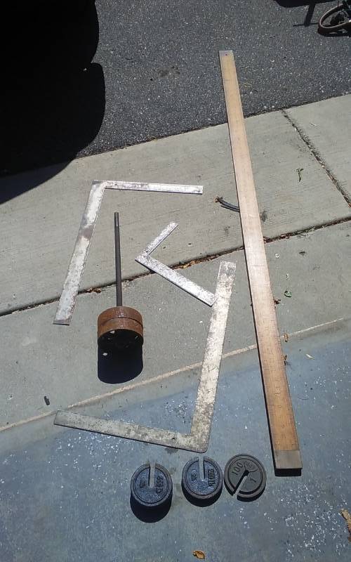 lot 108 image: 6 Ft Measure With Brass Ends, 3-Squares, 3-Old Scale Weights, Pair Of Cast Iron Wheels