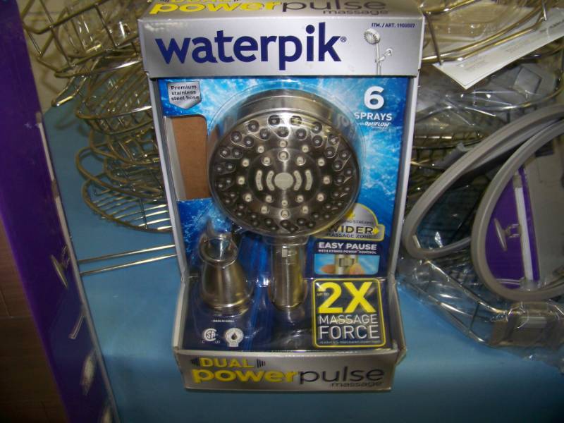lot 74 image: (2) Monsoon, Shower Organizers with many extra Accessories and (1) NEW, Waterpik, Dual Power Pulse Massage Shower Head