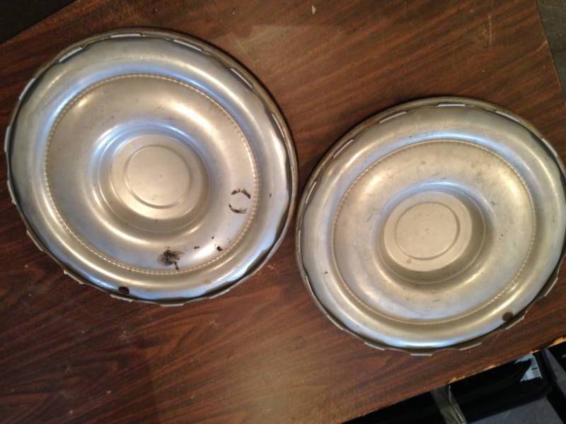 lot 37 image: Matching Antique wheel cover hubcaps (Set of 2)