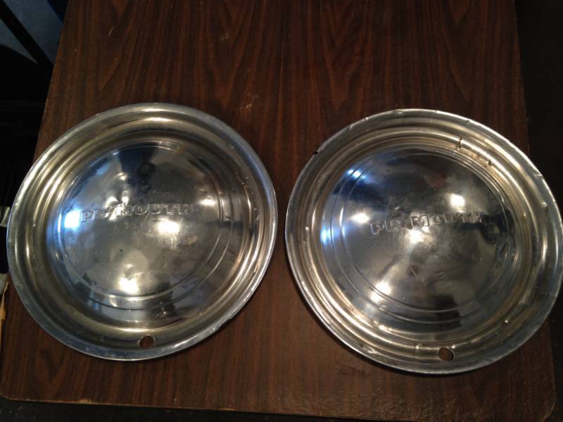 lot 38 image: Matching Antique Plymouth wheel covershubcaps (Set of 2)