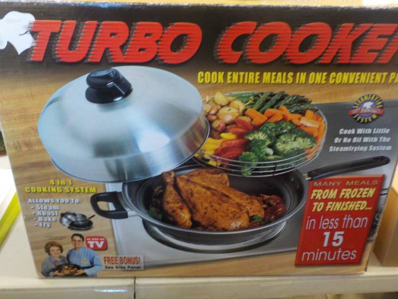 lot 77 image: New Turbo Cooker...
