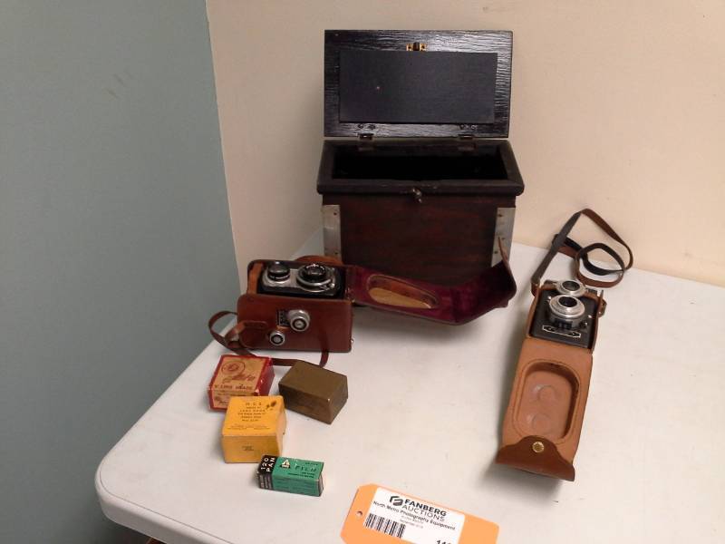 lot 110 image: Craft Products Corp. Hollywood Camera with Leather Case, Ciro-flex Camera with Leather Case, Milo V Lens Shade, H.C.E. Series VI Lens Hood, 120 PAN Tower Film, Wood case, Accessories