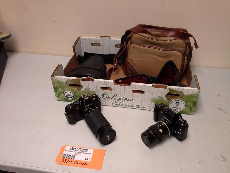 lot 101 image: Lot of (2) Nikon N2000 35mm Film Camera Bodies, 55mm 2.8 Lens, 35-300mm 3.0-4.5 Lens, Camera Cases, Auto-winder