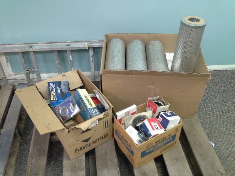 lot 2125 image: Stainless Steel Filters, AC Delco Distributor Cap, Performance Ceramic Brake Pads, Voltmeter Gauge, Moog Automotive Parts