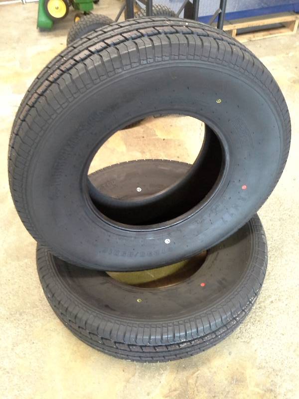 lot 987 image: Lot of (2) New Rubbermaster ST23585R16 Tires