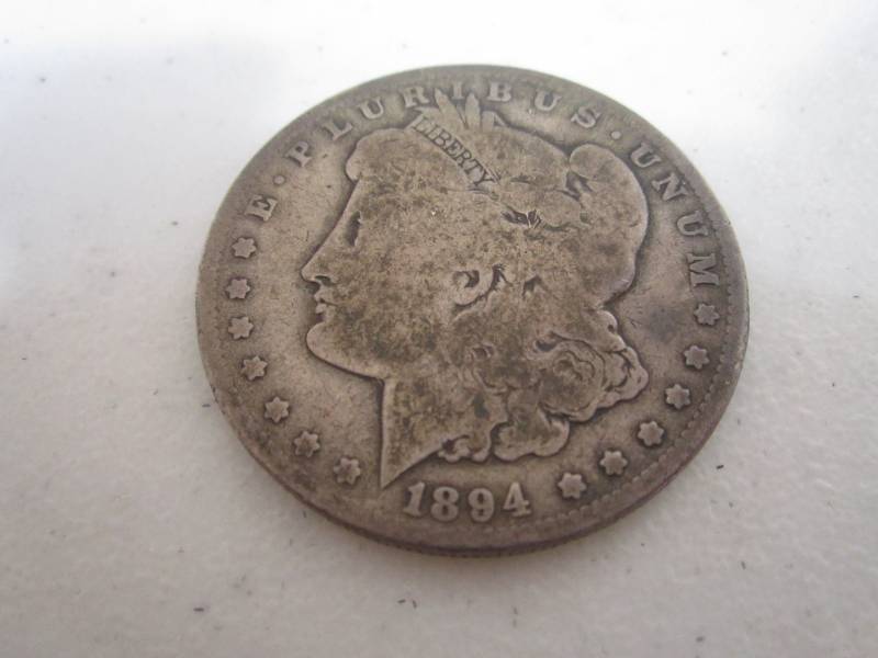 lot 429 image: 1894 O silver dollar...