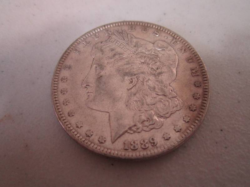 lot 432 image: 1889 Silver dollar...