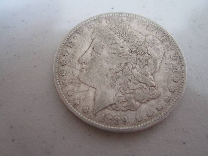 lot 434 image: 1889 Silver Dollar...