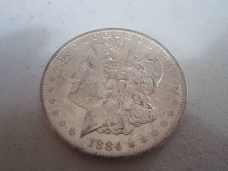 lot 448 image: 1884 O Silver dollar...