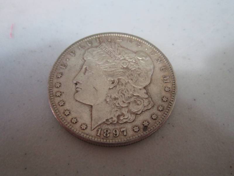 lot 454 image: 1897 S Silver Dollar...