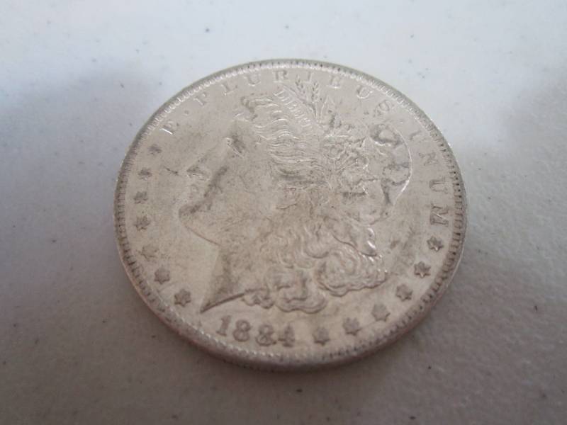 lot 457 image: 1884 O Silver dollar...