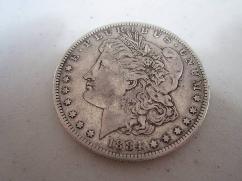 lot 460 image: 1884 S Silver Dollar...