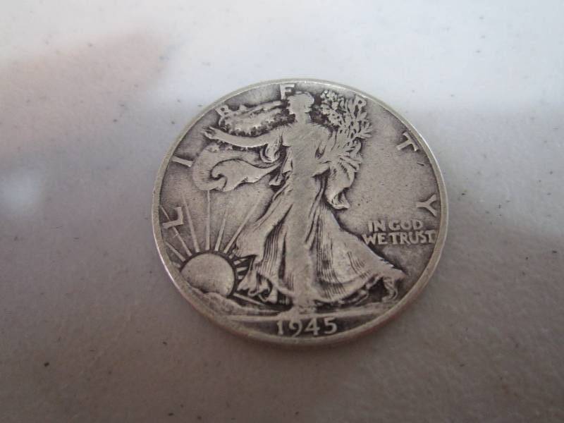 lot 239 image: 1945 half dollar...