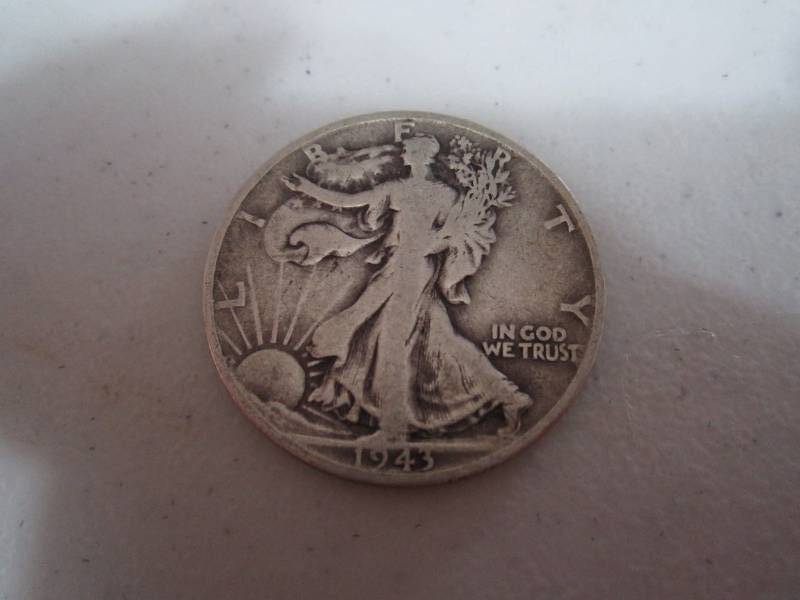 lot 242 image: 1943 S half dollar...
