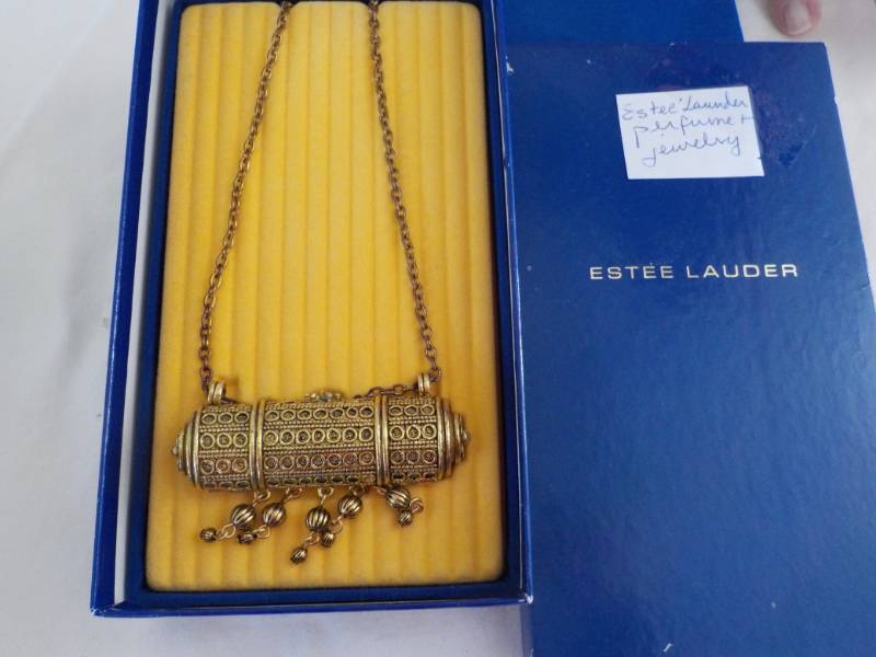 lot 34 image: Estee Lauder Perfume and Jewelry...