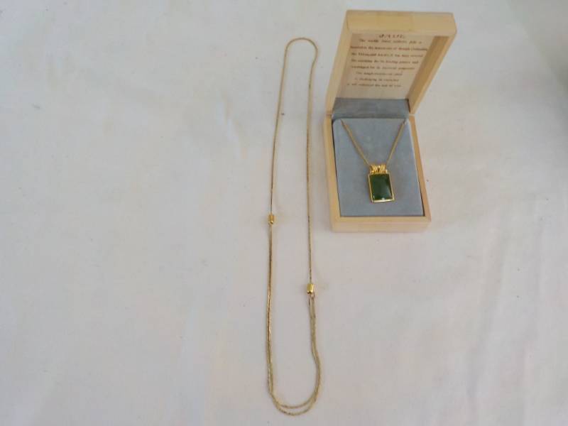 lot 61 image: Jade and Gold Necklace...