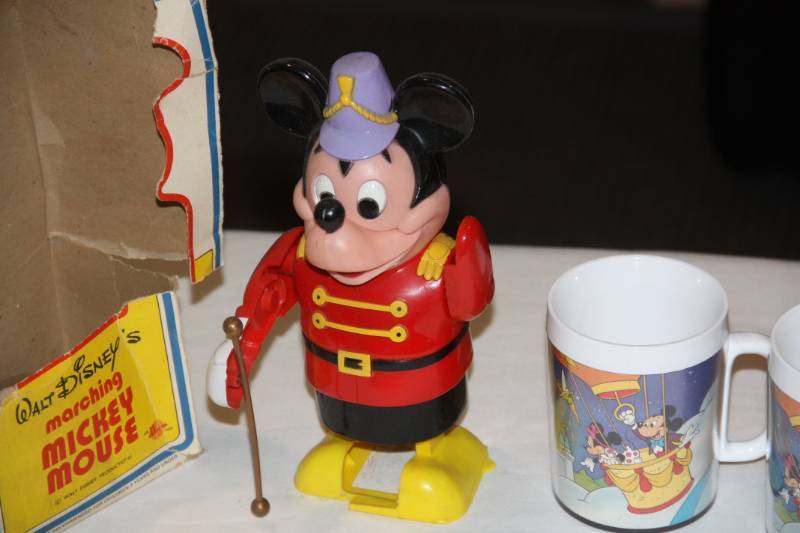 lot 25 image: Mickey Mouse Battery Operated Toy and Two Vintage Disneyland Mugs