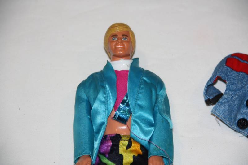 lot 28 image: Vintage Mattell Barbie Ken Doll with Accessories