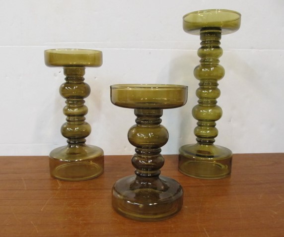 lot 52 image: Set of 3 Graduating Size Olive Glass Candle Stands