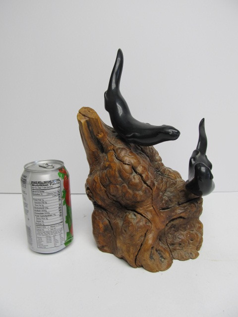 lot 65 image: JOHN PERRY Ebonite Double Seal Sculpture on Burlwood
