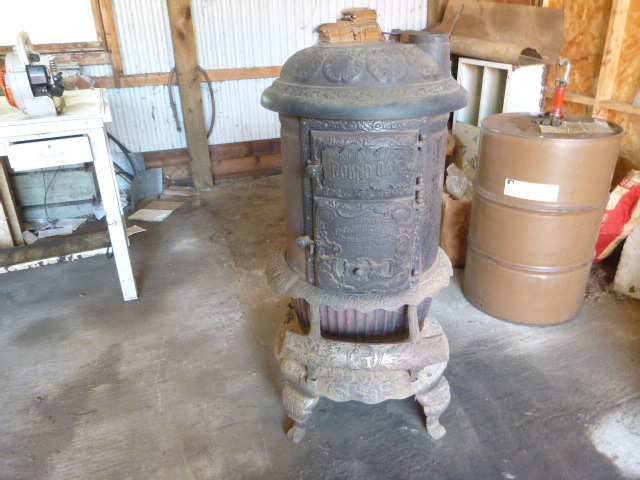 lot 38 image: Vintage Round Oak Wood Burning Stove