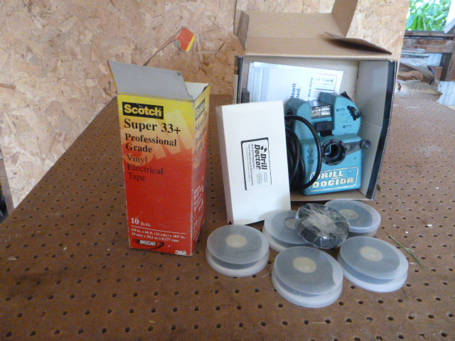 lot 96 image: Vinyl Electrical Tape and Drill Doctor Drill Bit Sharpener